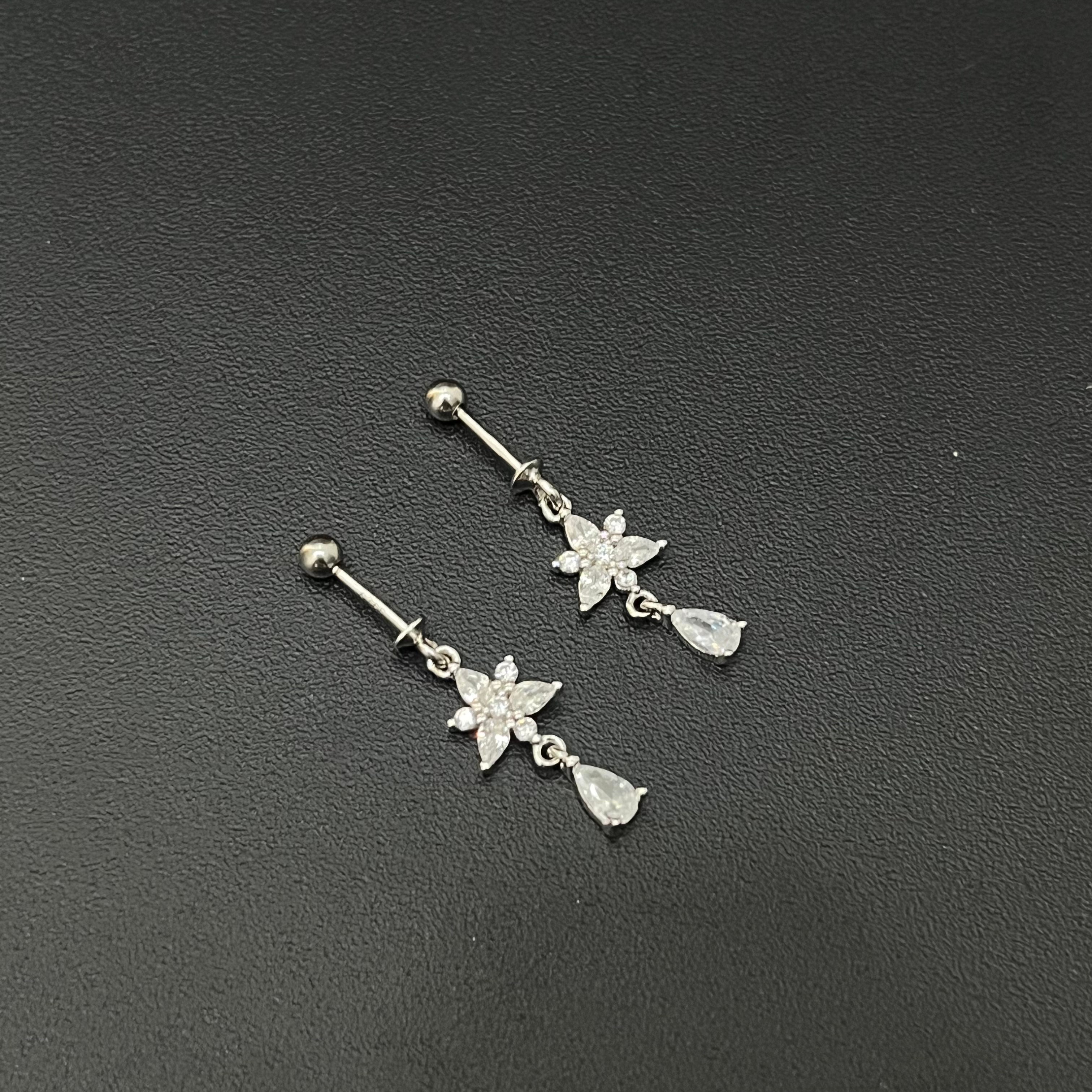 Silver Ladies Bugdis \Helix Studs White Flower