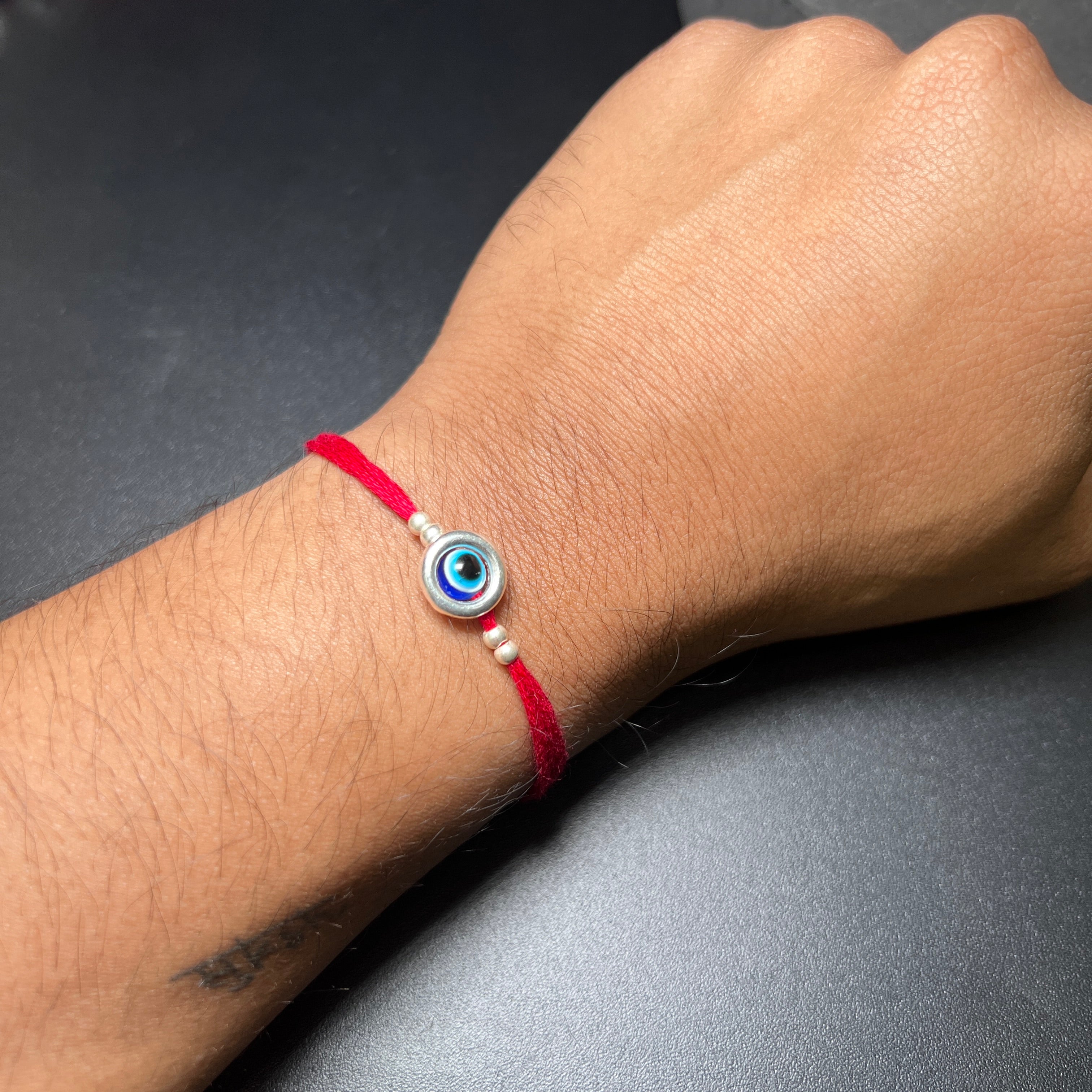Pure Silver Rakhi Rolling Evil Eye