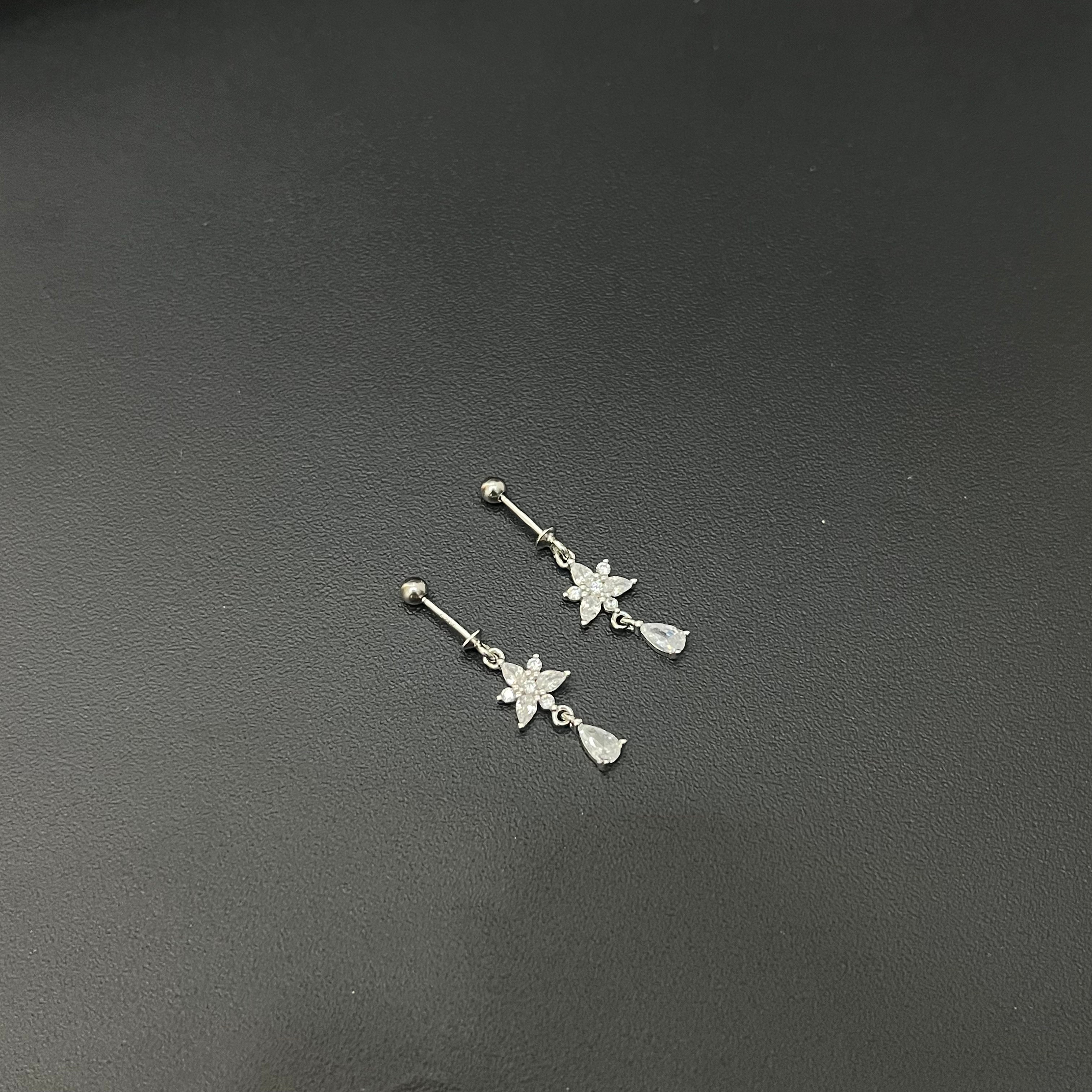Silver Ladies Bugdis \Helix Studs White Flower